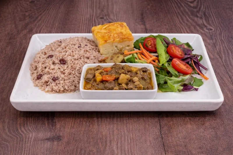 Curry with rice and peas and a fresh salad